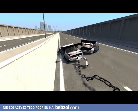 Samochody połączone łańcuchem kontra betonowy pachołek