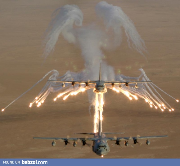 Lockheed AC-130 leaving behind flare 