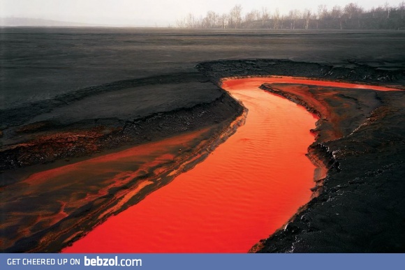 TIL there is a river in Canada that is dyed red by iron from a nearby nickel factory
