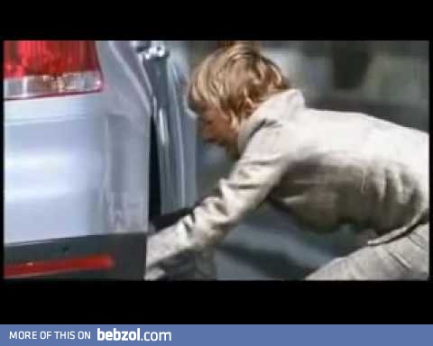 Woman is changing the flat tyre